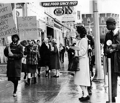 In 1960, demonstrators in downtown Bennington joined nationwide protests that pushed the Woolworth’s chain to end segregation of its lunch counters in the South. This photo, from the May 1960 Bennington College Bulletin, was credited to Jon L. Allen and is included in the new exhibit “Fields of Change: 1960s Vermont” at the Bennington Museum.