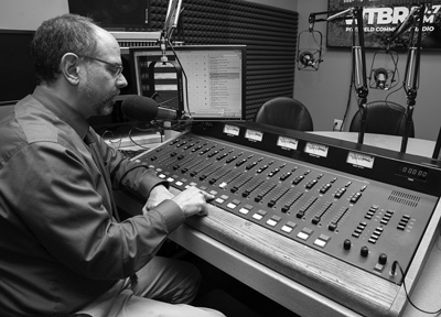 Shawn Serre, the executive director of Pittsfield Community Television, shows off the new home of radio station WTBR-89.7 FM, which temporarily suspended broadcasts in June. Susan Sabino photo