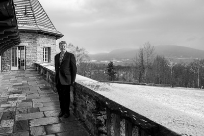 Southern Vermont College President David R. Evans stands on the patio outside his office in the college’s Everett Mansion. The college is one of three in the region that plan to close this spring. Joan K. Lentini photo