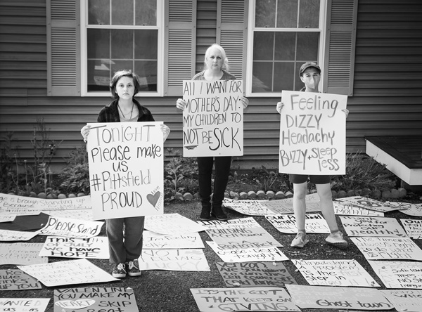 Courtney Gilardi and her daughters stand outside their home in Pittsfield, Photo by Susan Sabino.