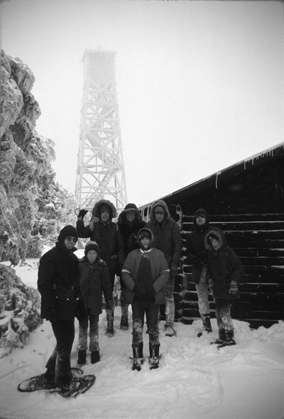 Ira Ellis, left, a founding member of Snowald, leads members of Boy Scout Troop 7 of North Haven, Conn., on a snowshoe hike in the 1970s. Snowald, a retreat founded in the 1950s on 250 acres high in the Green Mountains, continues to serve its  founders’ families and scouting groups to this day.