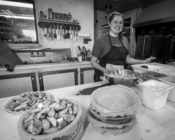 Katie Daino works on making pies in the kitchen of Smith’s Orchard & Bake Shop in Charlton. Daino’s mother, Shelley Smith, started the orchard’s baking operation in 1999; now they turn out more than 100 pies on an average day. Joan K. Lentini photo