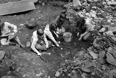 High-school students in a summer archaeological field school sift through the soil at a remote property in Sandgate, Vt., where leaders of the Shays Rebellion built an extensive community beginning in 1787. The rebels fled Massachusetts for Vermont, which was then an independent republic. Courtesy photo