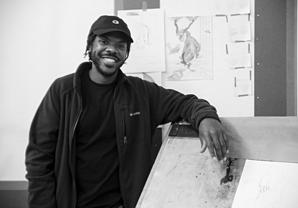 Joshua Ross, the artist in residence this fall at Massachusetts College of Liberal Arts, is working on a series of drawings in colored pencil in the Art Lab at Gallery 51, the college’s exhibition space in downtown North Adams. Susan Sabino photo