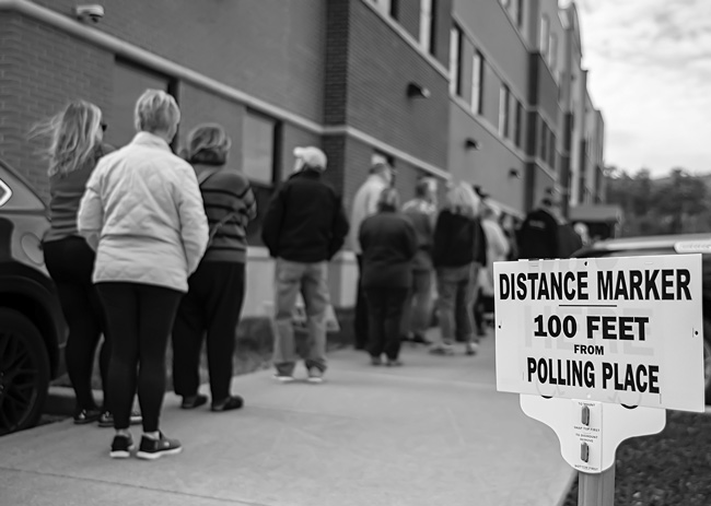Voters line up outside an early voting site last month at the Warren County Muniipal Center in Queensbury, N.Y. Joan K. Lentini photo