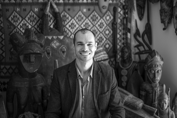 Justin Bibee sits among some of the objects from his collection of ethnographic art. He has created a no-cost loan program to display the works at libraries, schools and other institutions. Joan K. Lentini photo Justin Bibee sits among some of the objects from his collection of ethnographic art. He has created a no-cost loan program to display the works at libraries, schools and other institutions. Joan K. Lentini photo