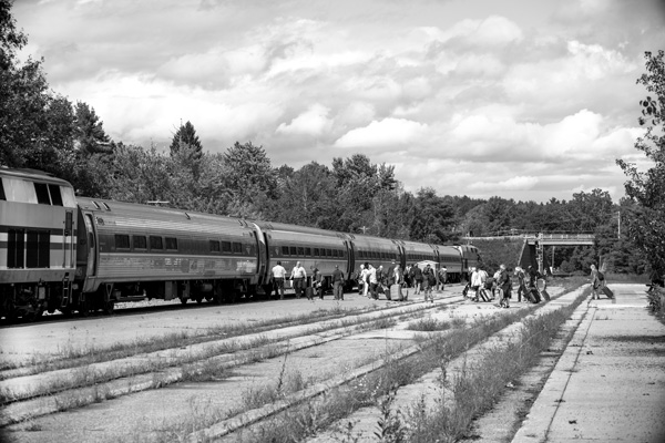 Travelers prepare to board Amtrak’s Ethan Allen Express last month in Saratoga Springs. The train, which previously ran between New York City and Rutland, now continues north to Burlington. Joan K. Lentini photo