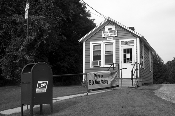 The post office in North Hoosick, N.Y., was among those targeted for closure in 2011. It survived, but the U.S. Postal Service cut its retail window service to just two hours per day. Tony Israel file photo