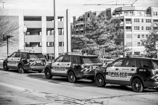 

Police cars line the street opposite the Saratoga Springs Police Department headquarters at City Hall. photo by Joan K. Lentini